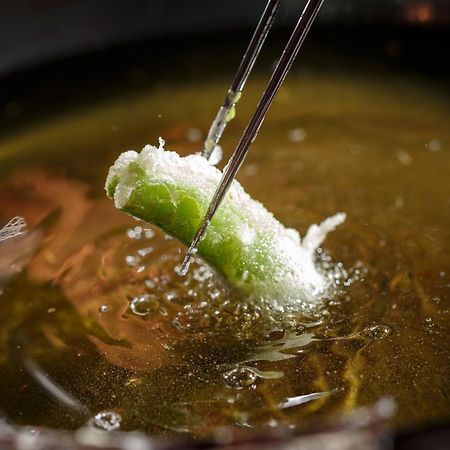 Hotel The Celestine Kyoto Gion Bagian luar foto A spring roll being dipped in hot oil